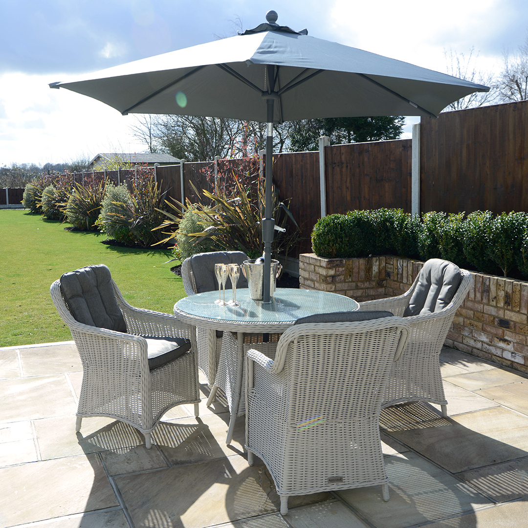 4 Seat Outdoor Cast Aluminium And Rattan Dining Sets Kensington Deluxe 110cm Round Table With 4 Henley Dining Armchairs Pebble